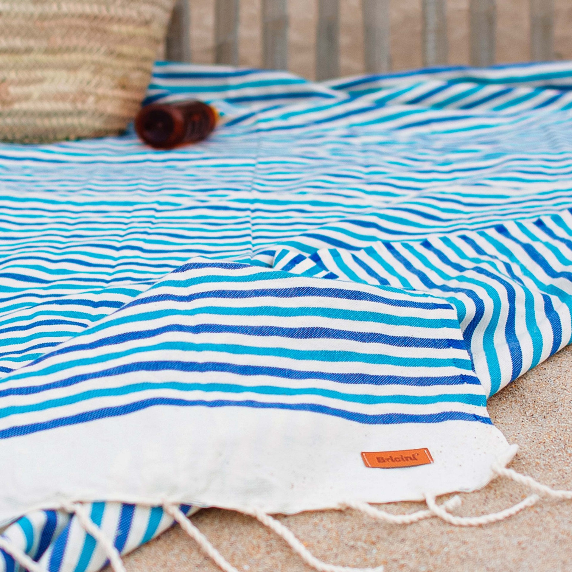 Ambiente toalla playa Aguda Briciní